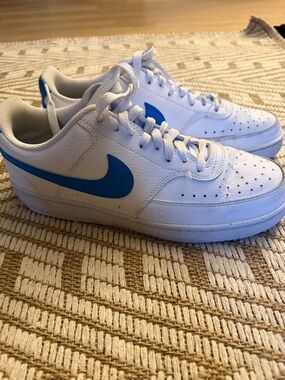 Nike White Low-Top Sneakers with Blue Swoosh